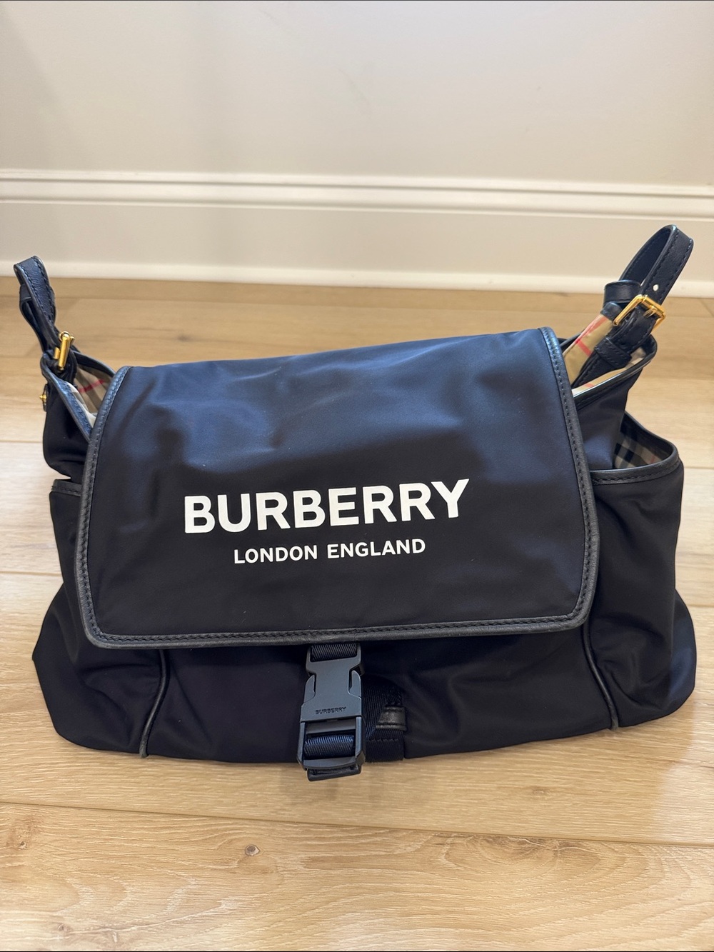 Burberry London England logo Diaper bag with check lining and gold hardware